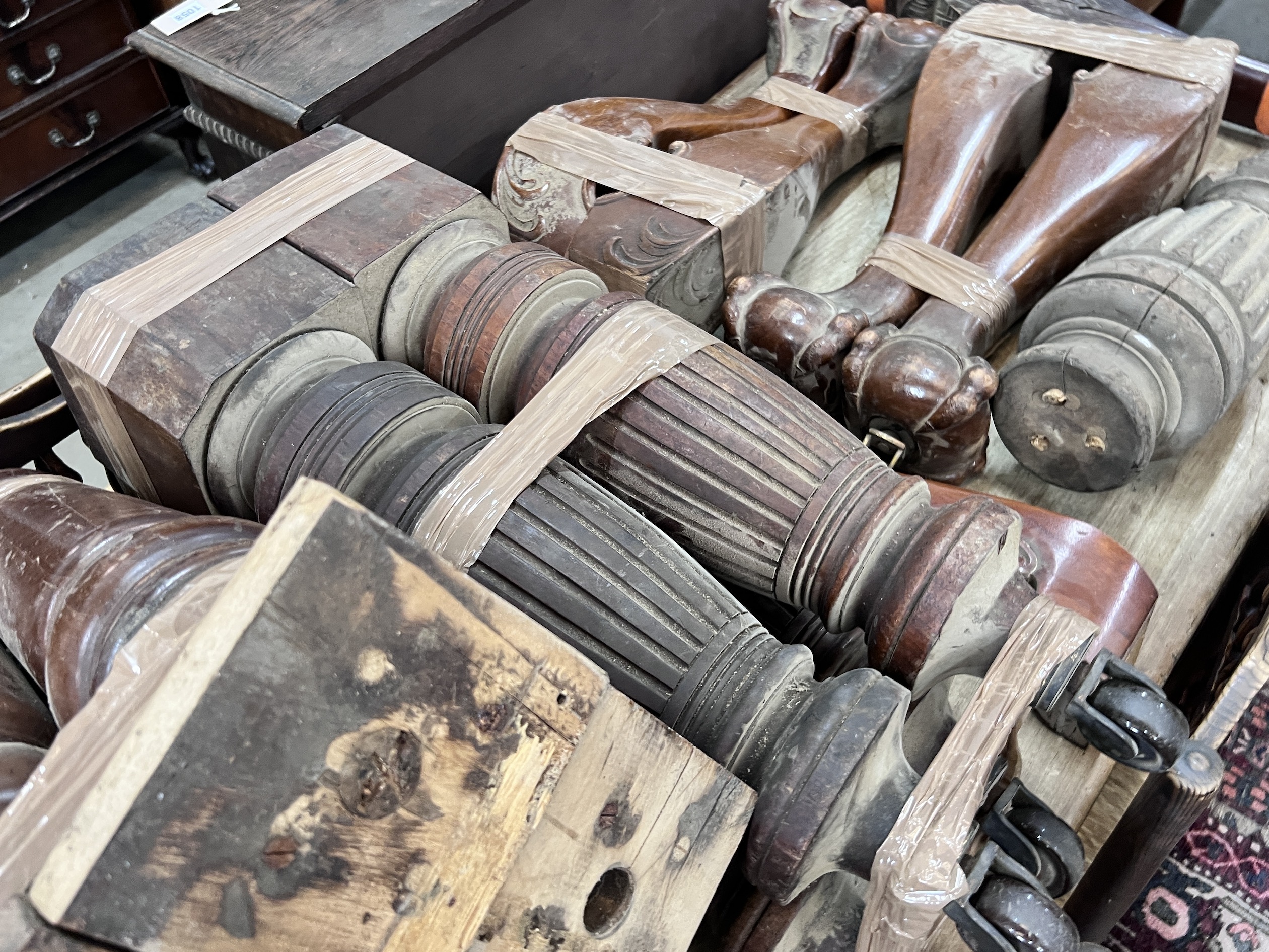 Seven sets of Victorian and later mahogany table legs, tallest 79cm